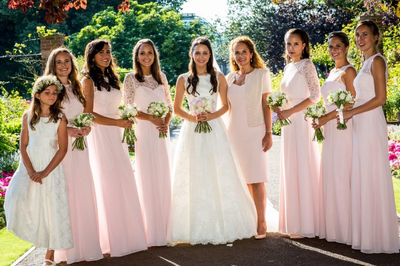 London bride and bridesmaids outside in hair and makeup.