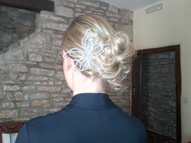 A lady showcases her bridal hair style by Rugby hair dresser