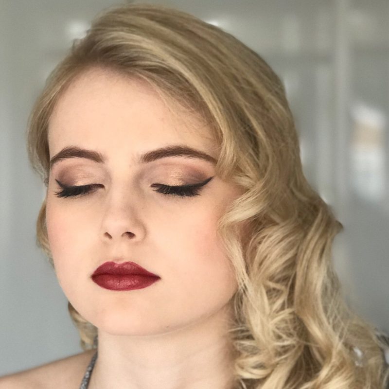 A female showcases her professional makeup by Cambridge artist