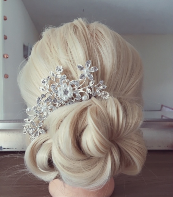 A hair stand showcases skills by Wedding hair stylist in Devon